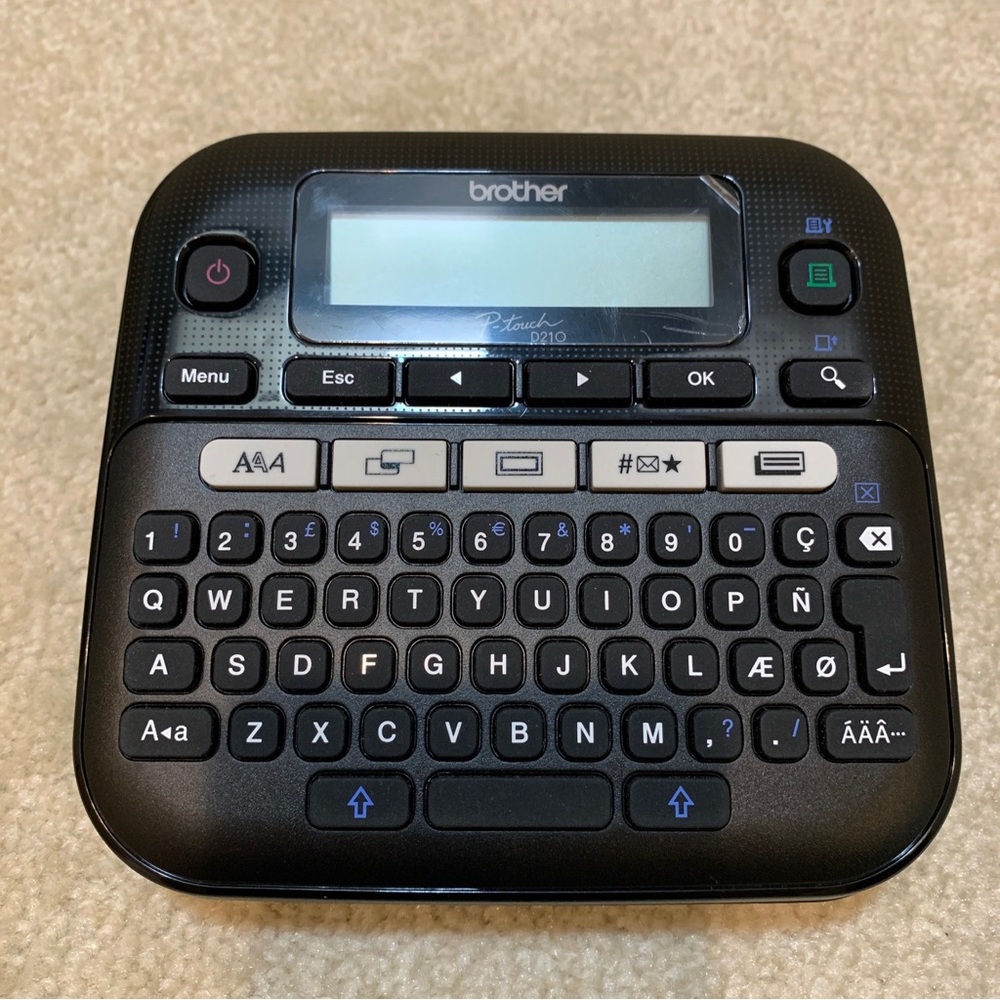Brother P-Touch D210 Electronic Label Maker Easy Compact Black TZe Tape Working